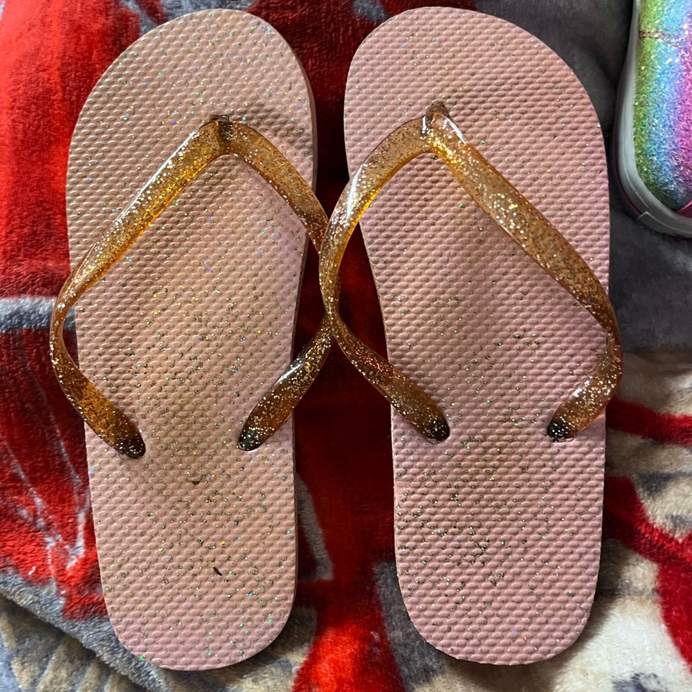 Rose gold flip flops